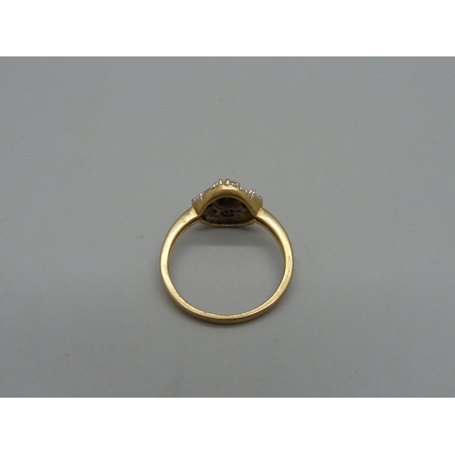 1025 - A 9ct gold and diamond ring, 2.8g, Q