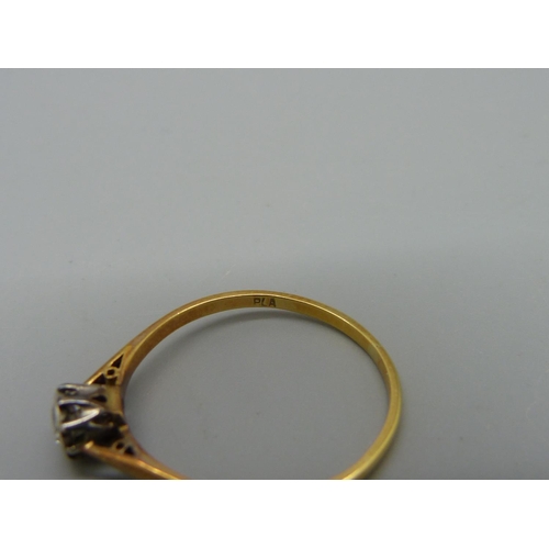 1027 - A yellow metal and diamond ring, 1.9g, S