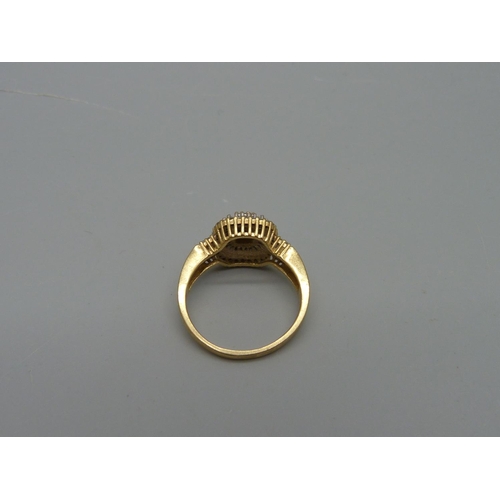 1028 - A 9ct gold and diamond ring, 4.2g, Q