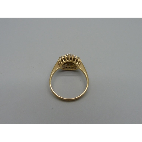 1031 - A 9ct gold and diamond ring, 3.5g, T