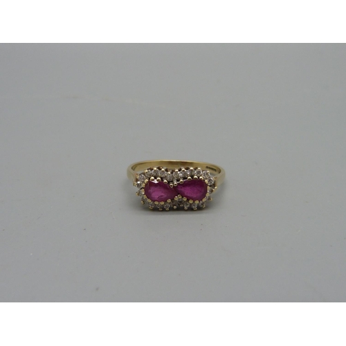 1032 - A 9ct gold, ruby and white stone ring, 2.4g, M