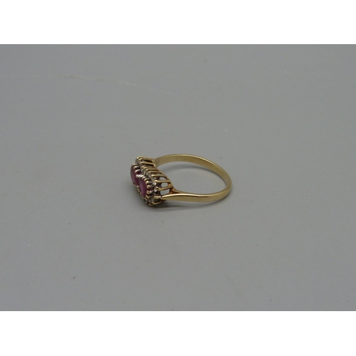 1032 - A 9ct gold, ruby and white stone ring, 2.4g, M