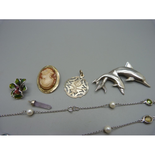 1034 - A 925 silver dolphin brooch, two necklaces, a silver and enamel flower pendant, etc.