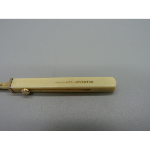 1038 - An ivory and gold toothpick by Sampson Morden & Co., 'T.C. Palmer-Inventor'