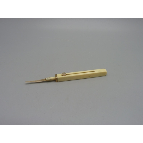 1038 - An ivory and gold toothpick by Sampson Morden & Co., 'T.C. Palmer-Inventor'