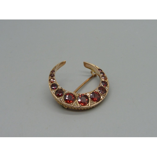 1040 - A 9ct gold, garnet and rose cut diamond crescent brooch, Chester 1909, 4g