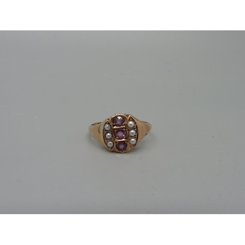 1053 - A yellow metal, amethyst and pearl ring, marked 9K, 3g, O