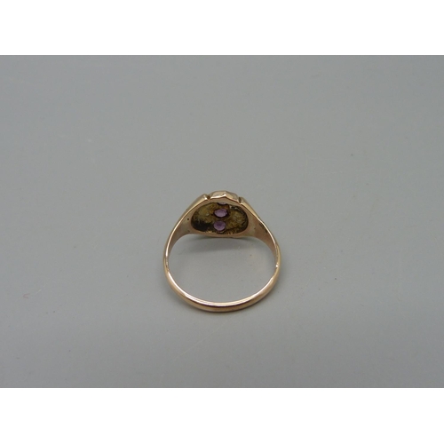 1053 - A yellow metal, amethyst and pearl ring, marked 9K, 3g, O