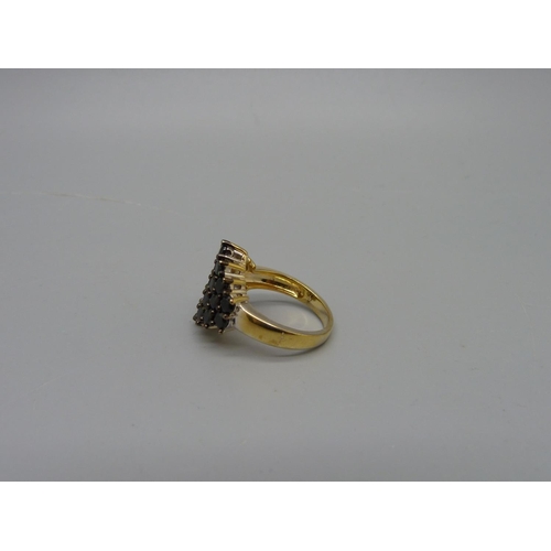 1054 - A silver gilt, pave set black spinel cluster ring, L