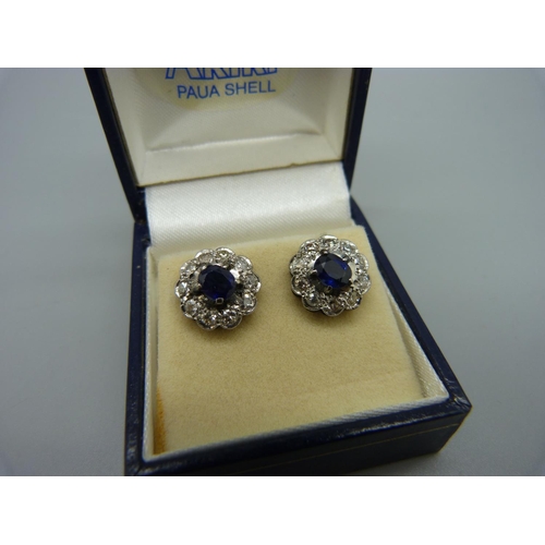 1058 - A pair of sapphire and diamond cluster earrings, 7mm