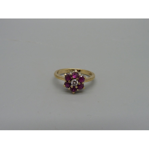 1059 - A 14ct gold, ruby and diamond cluster ring, marked 585, 3.2g, O