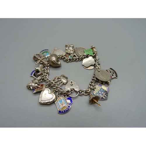 1062 - A silver charm bracelet, 56g