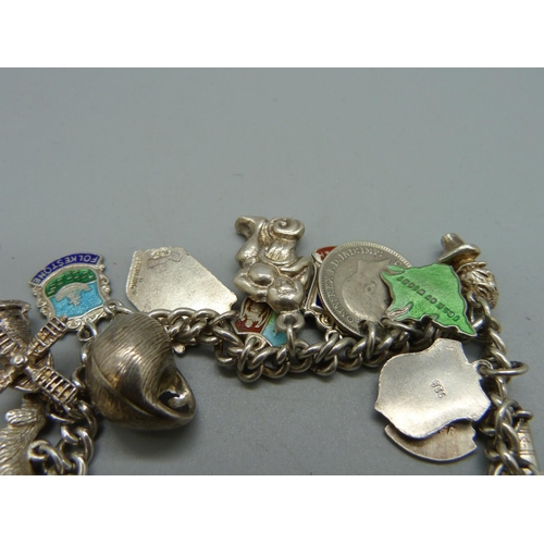 1062 - A silver charm bracelet, 56g