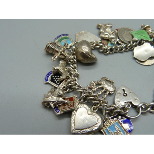 1062 - A silver charm bracelet, 56g