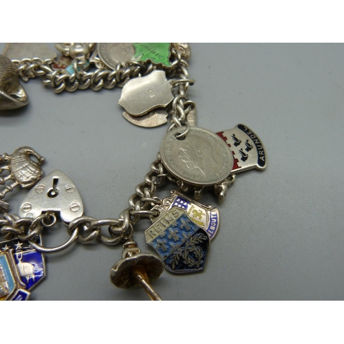 1062 - A silver charm bracelet, 56g