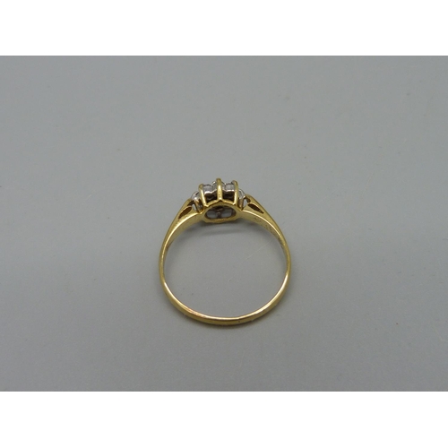 1066 - An 18ct gold, nine stone diamond cluster ring, 2.2g, O