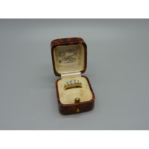 1067 - A Victorian 18ct gold, five stone opal ring, Birmingham 1864, 2.7g, K, one opal a/f