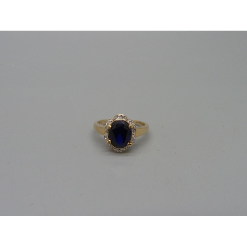 1068 - A 9ct gold, blue spinel and diamond ring, 2.3g, M