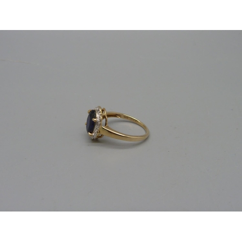 1068 - A 9ct gold, blue spinel and diamond ring, 2.3g, M