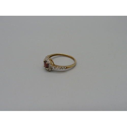 1072 - A 9ct gold, garnet and white stone ring, 1.8g, P