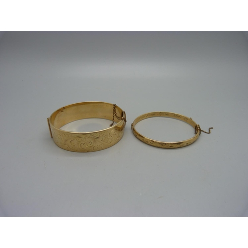 1078 - Two 9ct gold bronze core bangles, one with inscription