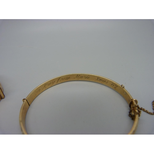 1078 - Two 9ct gold bronze core bangles, one with inscription