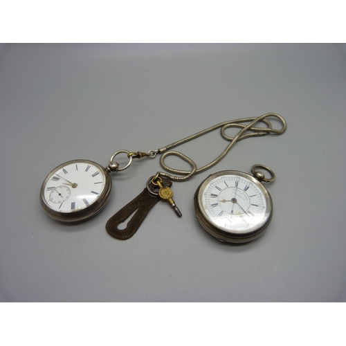 1081 - A silver pocket watch with key and a silver centre seconds chronograph pocket watch