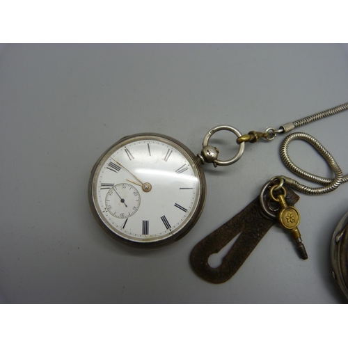 1081 - A silver pocket watch with key and a silver centre seconds chronograph pocket watch