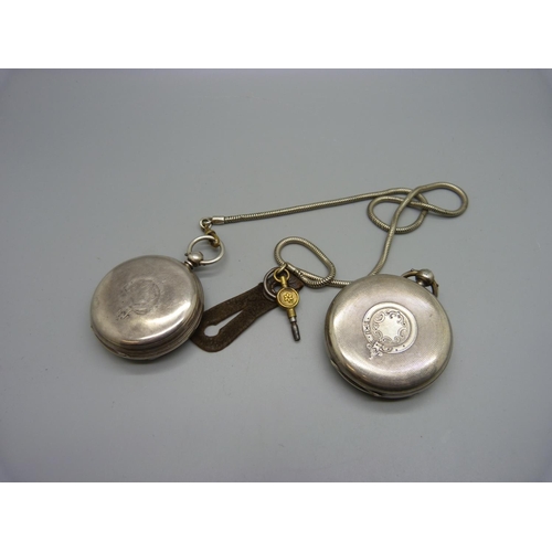 1081 - A silver pocket watch with key and a silver centre seconds chronograph pocket watch