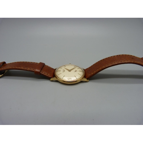 1090 - A 9ct gold Longines wristwatch, 32mm case