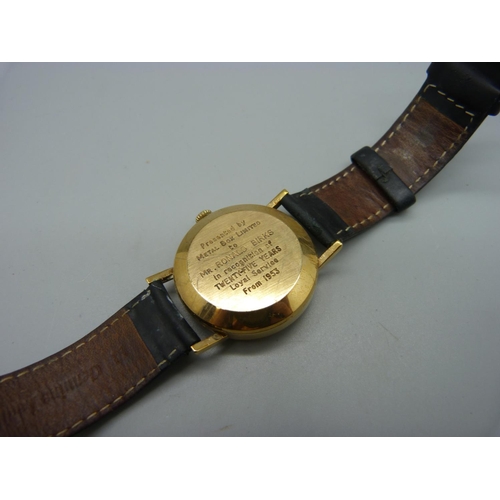 1093 - A 9ct gold Garrard automatic wristwatch, the 33mm case bears inscription