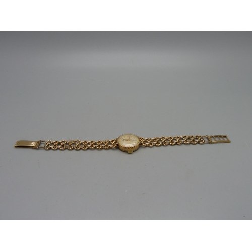 1100 - A lady's 9ct gold Tudor Royal wristwatch on a 9ct gold bracelet strap marked Rolex, total weight 21.... 