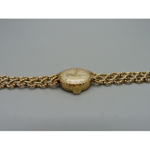 1100 - A lady's 9ct gold Tudor Royal wristwatch on a 9ct gold bracelet strap marked Rolex, total weight 21.... 