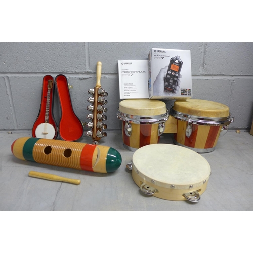 1141 - A set of bongos, a tambourine, a percussion piece, miniature model of a banjo, a Yamaha Pocketrak PK... 