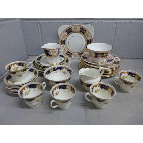 1156 - A Warwick Heathcote tea service including five cups and seven saucers and one other part tea service... 