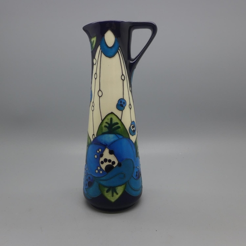 607 - A Moorcroft Pottery Jug, decorated in the Rennie Rose Blue design by Rachel Bishop, first quality, i... 