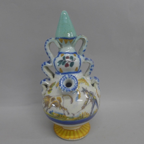 616 - A 19th Century faience drinking vessel, base a/f (restored), 21.5cm