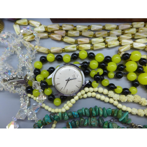 620 - A collection of vintage jewellery including a rosary, wristwatches and a carved bone necklace