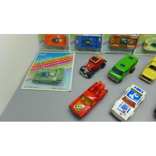 634 - Six Tins' Toys model vehicles in packets and other loose Matchbox model vehicles