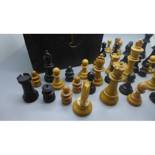 654 - A set of Staunton style chess pieces, one black pawn missing plus twelve spare pieces in a pine box