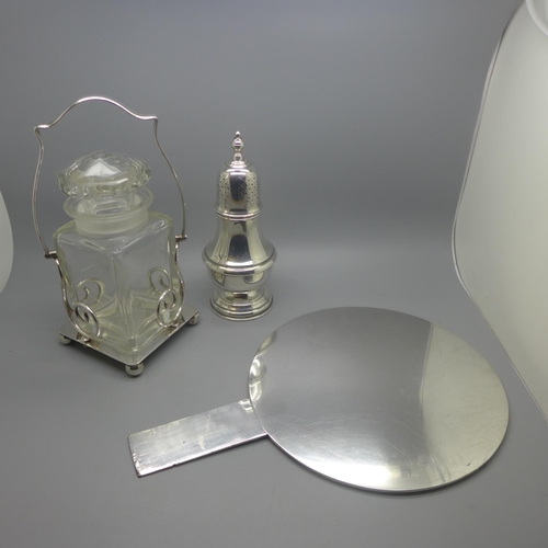 666 - A silver plated Mappin & Webb sugar sifter, an oriental mirror and glass and a silver plated pickle ... 