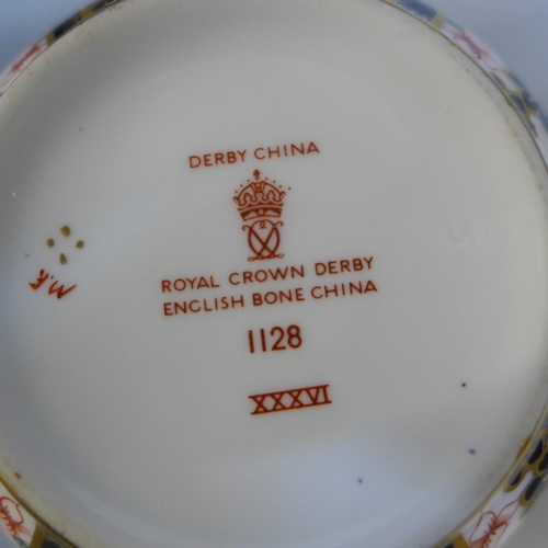 715 - A Royal Crown Derby 1128 pattern dinner plate, four side plates, seven tea plates and a large cup an... 