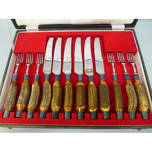 719 - A cased set of Butcher & Swann steak knives and forks with silver plated embellishments