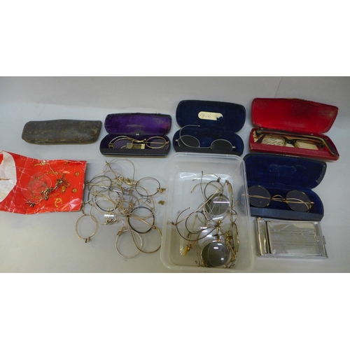 723 - A collection of spectacles, some complete in case and in parts