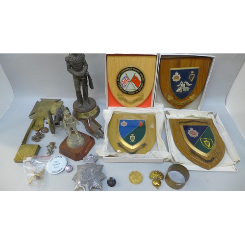 733 - Militaria; trench art, badges, plaques, model cannon, etc.