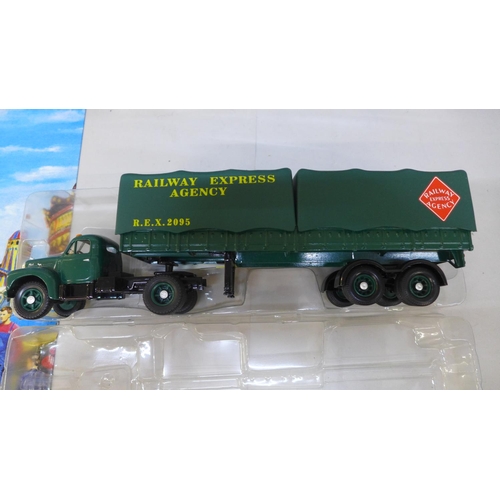 738 - Four Corgi model vehicles, boxed and a modern tin sign