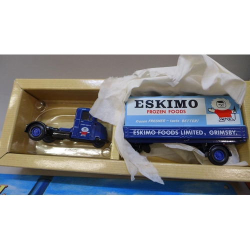 738 - Four Corgi model vehicles, boxed and a modern tin sign