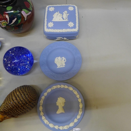 740 - A pair of Phoenix Ware vases, seven glass paperweights, a Wade hedgehog and four items of Wedgwood J... 