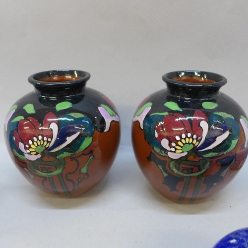 740 - A pair of Phoenix Ware vases, seven glass paperweights, a Wade hedgehog and four items of Wedgwood J... 