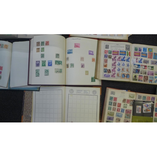 761 - A box of assorted stamp albums and a scrap book